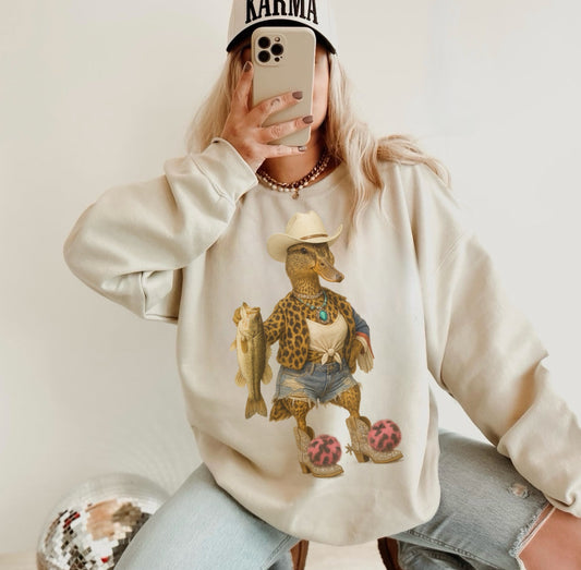 Fishing Cowgirl Duck Kids–Adult Gildan Sand Shirt – Graphic Tee, Long Sleeve & Crewneck.