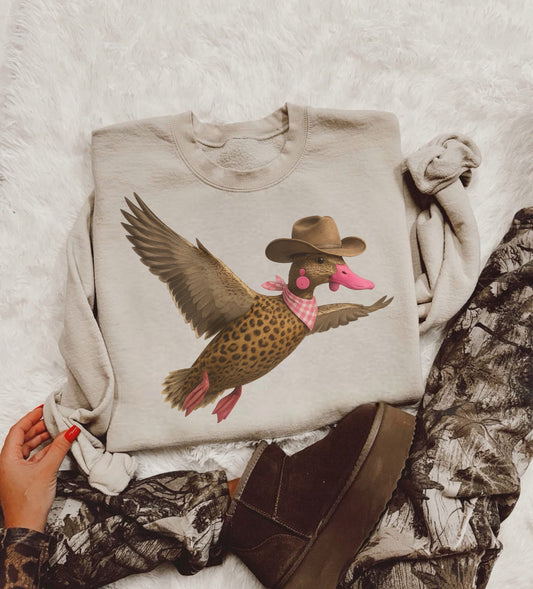 Cowgirl Duck Graphic Kids–Adult Gildan Sand Shirt – Graphic Tee, Long Sleeve & Crewneck.