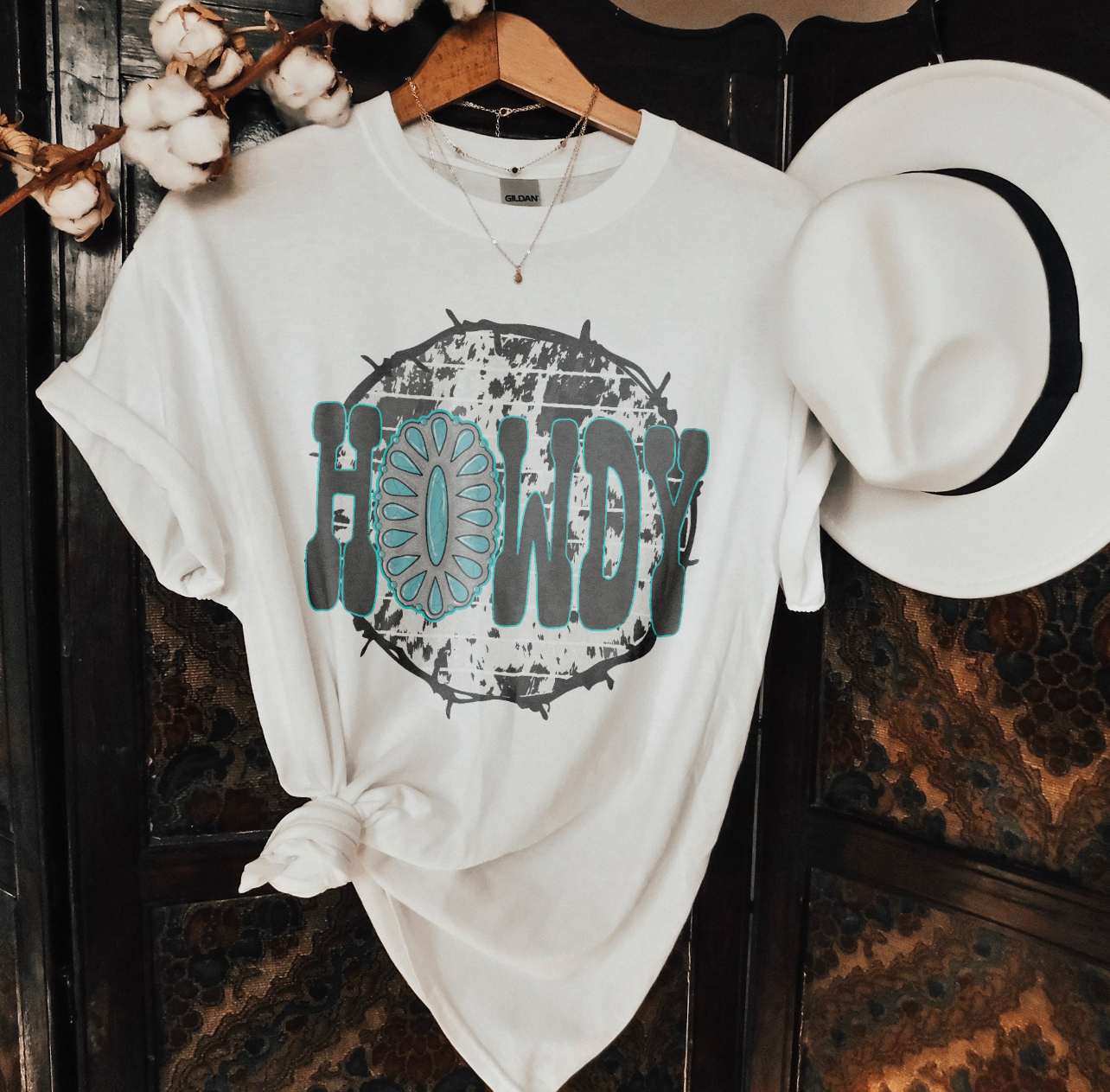 Howdy Turquoise Concho Graphic on Gildan Softstyle White Shirt – Graphic Tee, Long Sleeve & Crewneck.