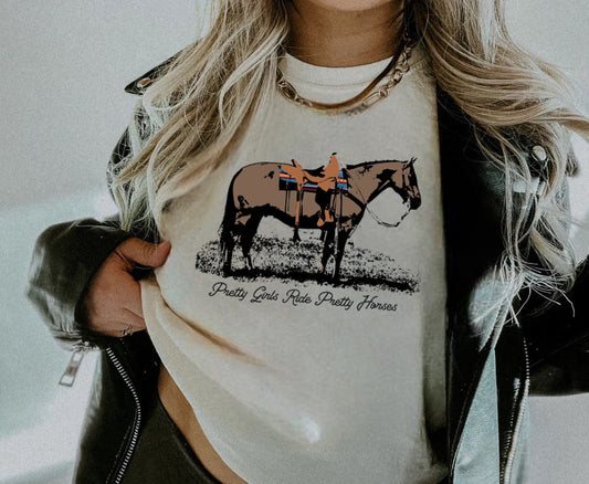 Pretty Girls Ride Pretty Horses Graphic on Gildan Softstyle Natural Shirt – Graphic Tee, Long Sleeve & Crewneck.